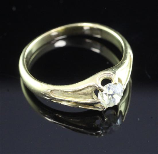 A gold and claw set solitaire diamond ring, size P.